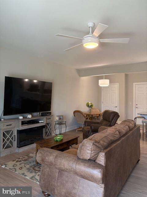 30609 Cedar Neck Road, Unit 3109 Ocean View, DE 19970 - Photo 12 of 44 a living room with furniture and a flat screen tv