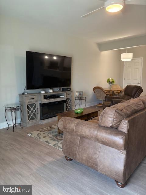 30609 Cedar Neck Road, Unit 3109 Ocean View, DE 19970 - Photo 13 of 44 a living room with furniture and a flat screen tv