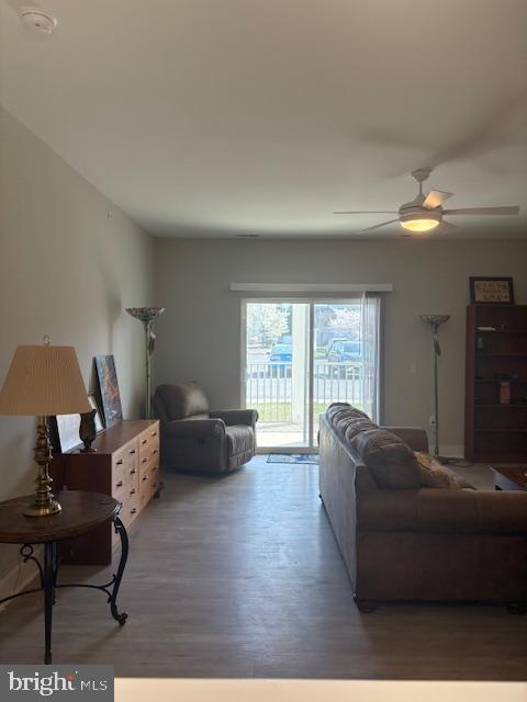30609 Cedar Neck Road, Unit 3109 Ocean View, DE 19970 - Photo 15 of 44 a living room with furniture and a large window