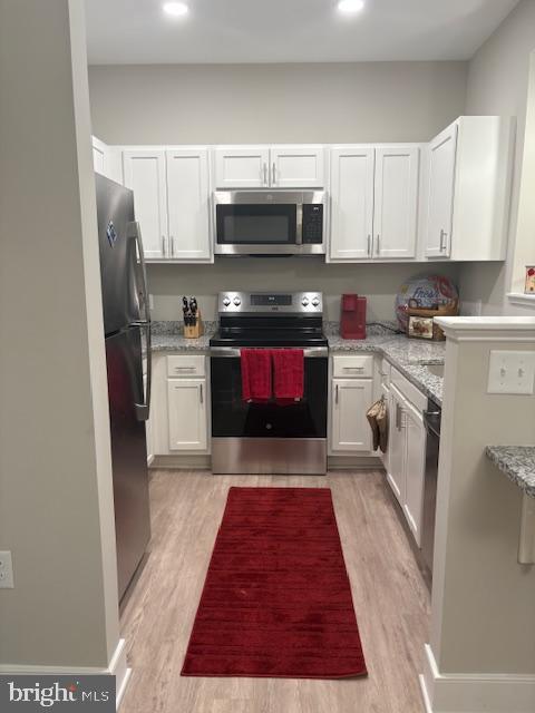 30609 Cedar Neck Road, Unit 3109 Ocean View, DE 19970 - Photo 19 of 44 a kitchen with stainless steel appliances granite countertop a refrigerator stove and sink