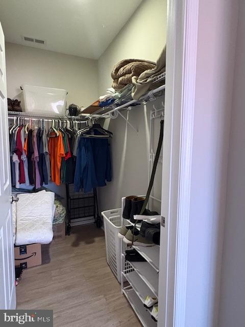30609 Cedar Neck Road, Unit 3109 Ocean View, DE 19970 - Photo 31 of 44 a view of walk in closet with clothes and shoes