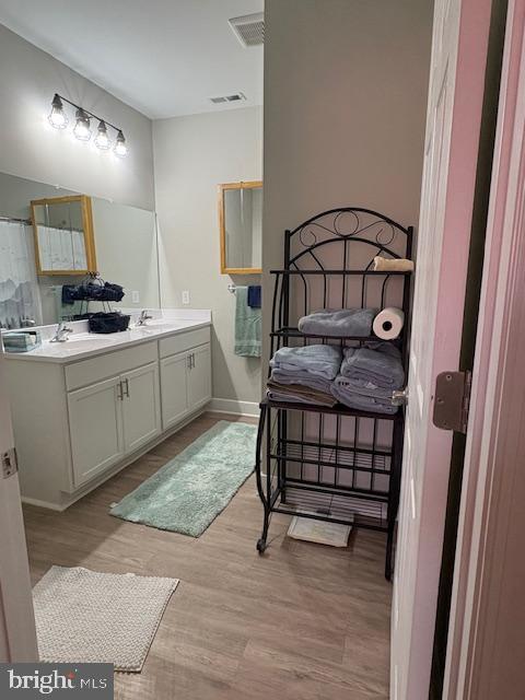 30609 Cedar Neck Road, Unit 3109 Ocean View, DE 19970 - Photo 32 of 44 a bedroom with a bed and a sink