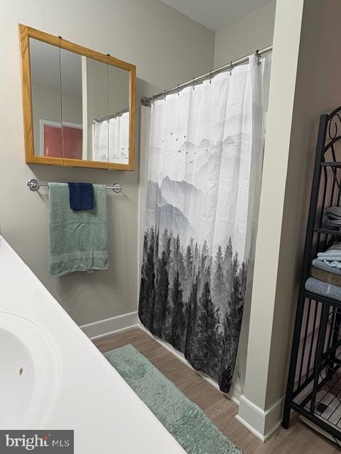 30609 Cedar Neck Road, Unit 3109 Ocean View, DE 19970 - Photo 34 of 44 a bathroom with a shower and a tub