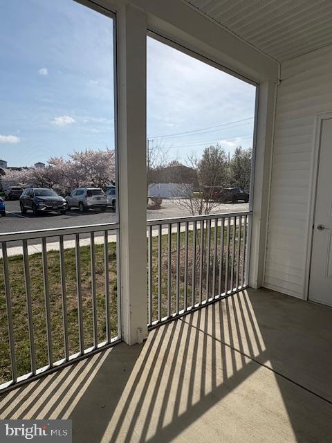30609 Cedar Neck Road, Unit 3109 Ocean View, DE 19970 - Photo 37 of 44 a view of a balcony with wooden floor