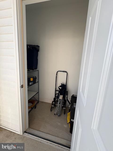 30609 Cedar Neck Road, Unit 3109 Ocean View, DE 19970 - Photo 38 of 44 a view of walk in closet with clothes and shoes
