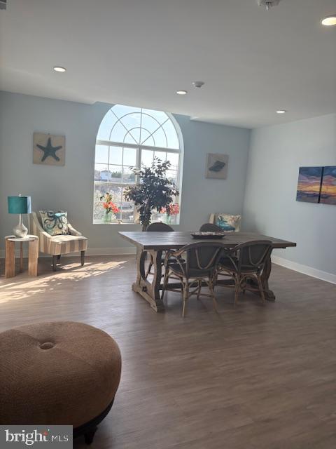 30609 Cedar Neck Road, Unit 3109 Ocean View, DE 19970 - Photo 41 of 44 a view of a dining room with furniture and a large window