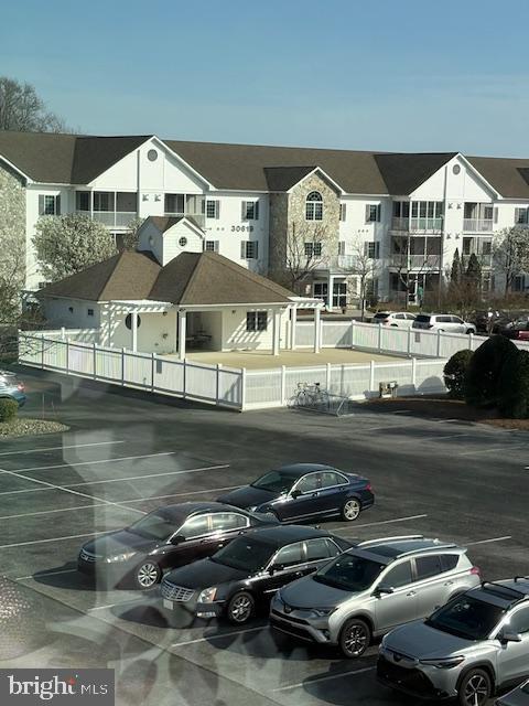 30609 Cedar Neck Road, Unit 3109 Ocean View, DE 19970 - Photo 43 of 44 a front view of a house with swimming pool
