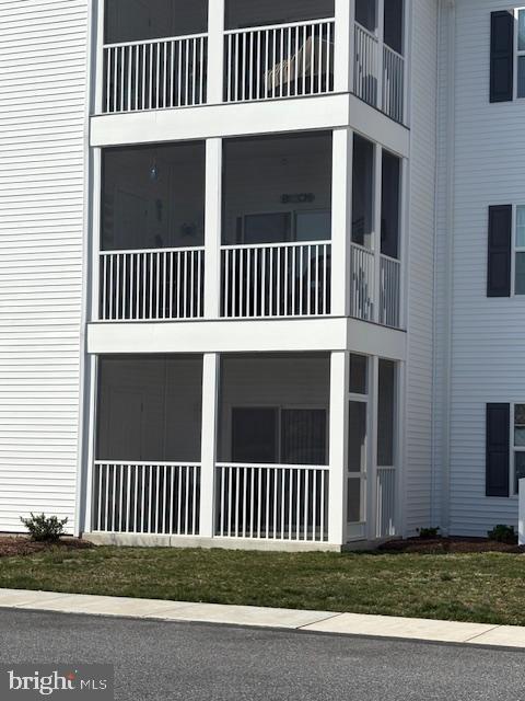 30609 Cedar Neck Road, Unit 3109 Ocean View, DE 19970 - Photo 5 of 44 a view of a house with a deck