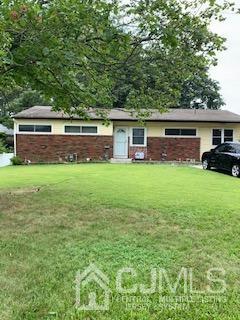 137 Princeton Road Old Bridge, NJ 08859 - Photo 3 of 6 a house view with a sitting space and garden