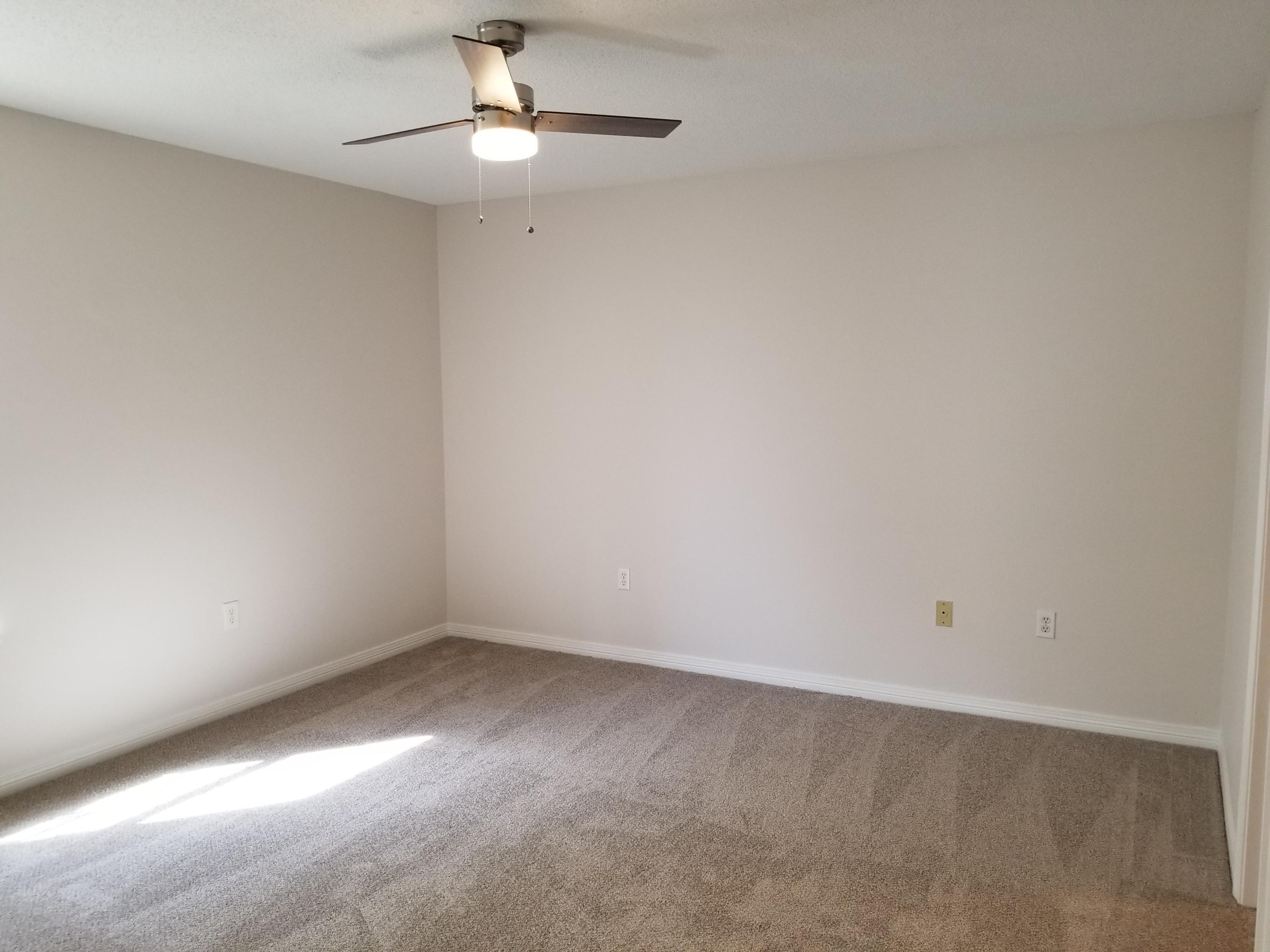 307 Rue Dianne Mary Esther, FL 32569 - Photo 4 of 17 a view of an empty room with a chandelier fan