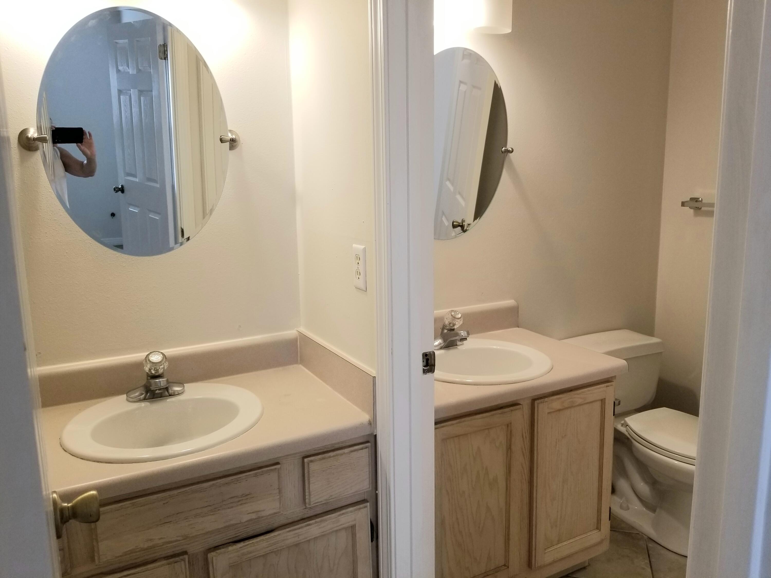 307 Rue Dianne Mary Esther, FL 32569 - Photo 7 of 17 a bathroom with a sink a toilet and mirror