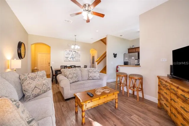 a living room with furniture fireplace and flat screen tv