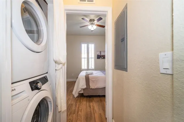 a bedroom with a bed and a mirror