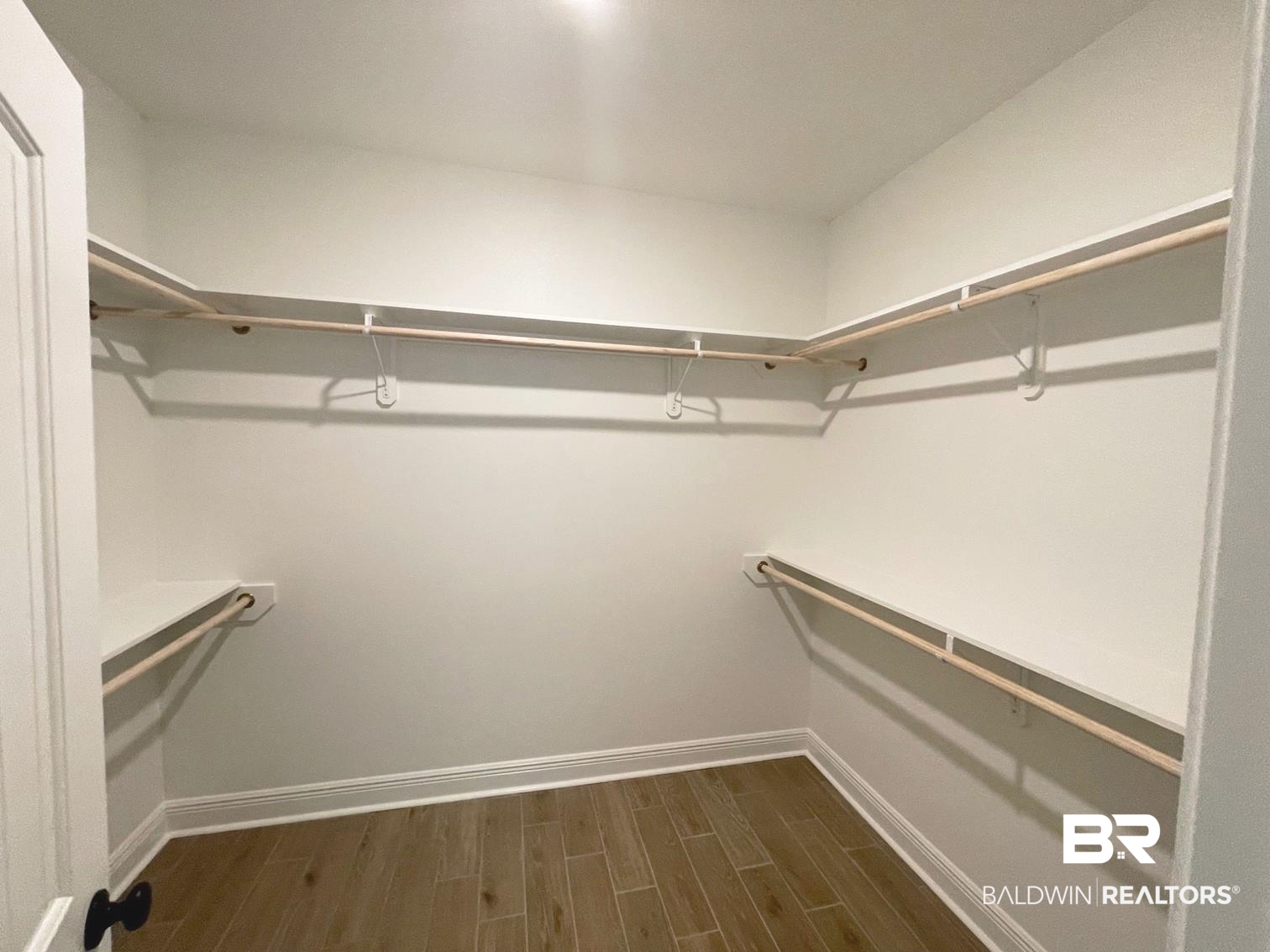 1579 Fenton Circle Foley, AL 36535 - Photo 7 of 14 Walk in closet featuring dark wood-type flooring