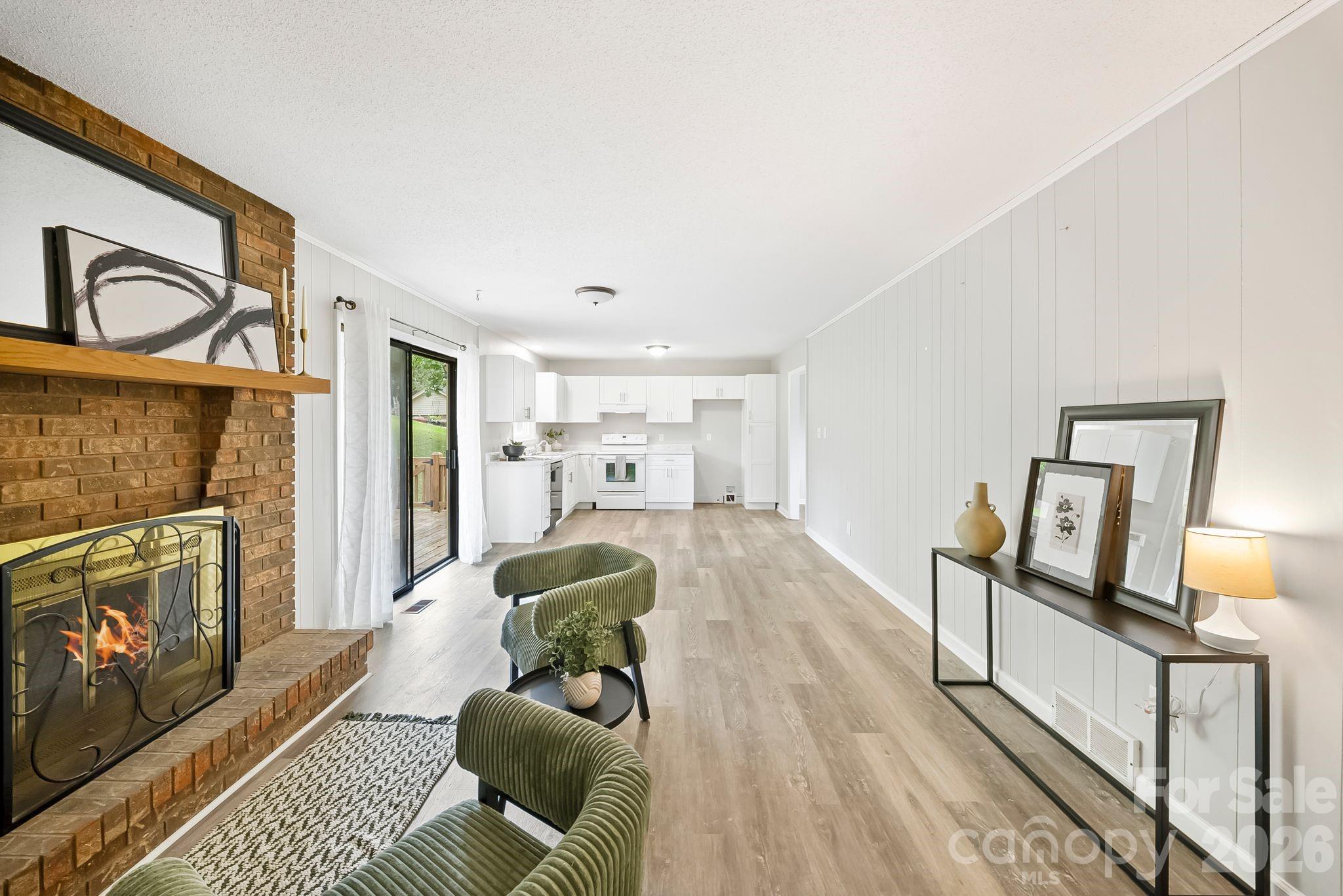 16 Sun Valley Court Alexander, NC 28701 - Photo 15 of 47 a living room with furniture and a fireplace