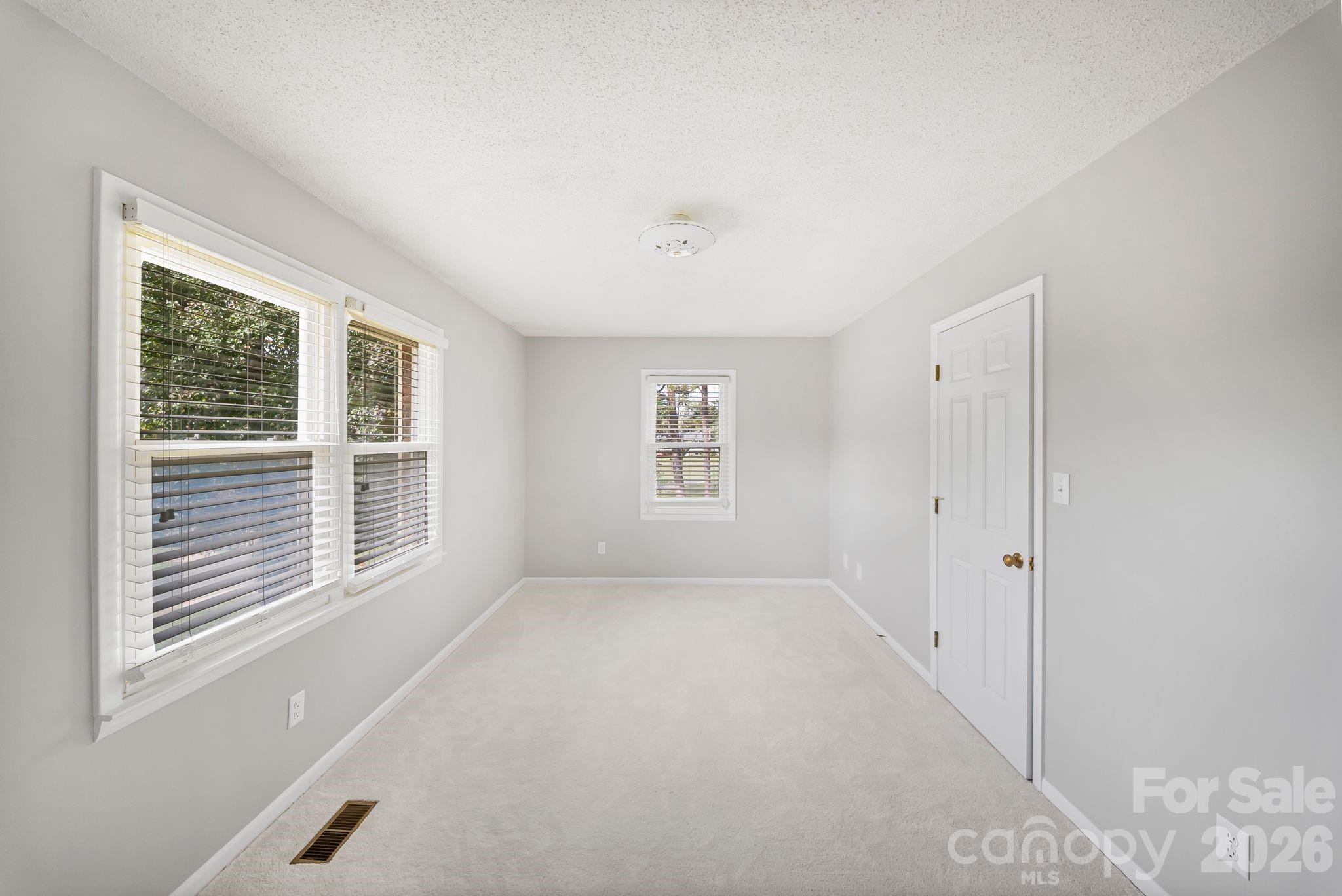 16 Sun Valley Court Alexander, NC 28701 - Photo 23 of 47 a view of an empty room with a window