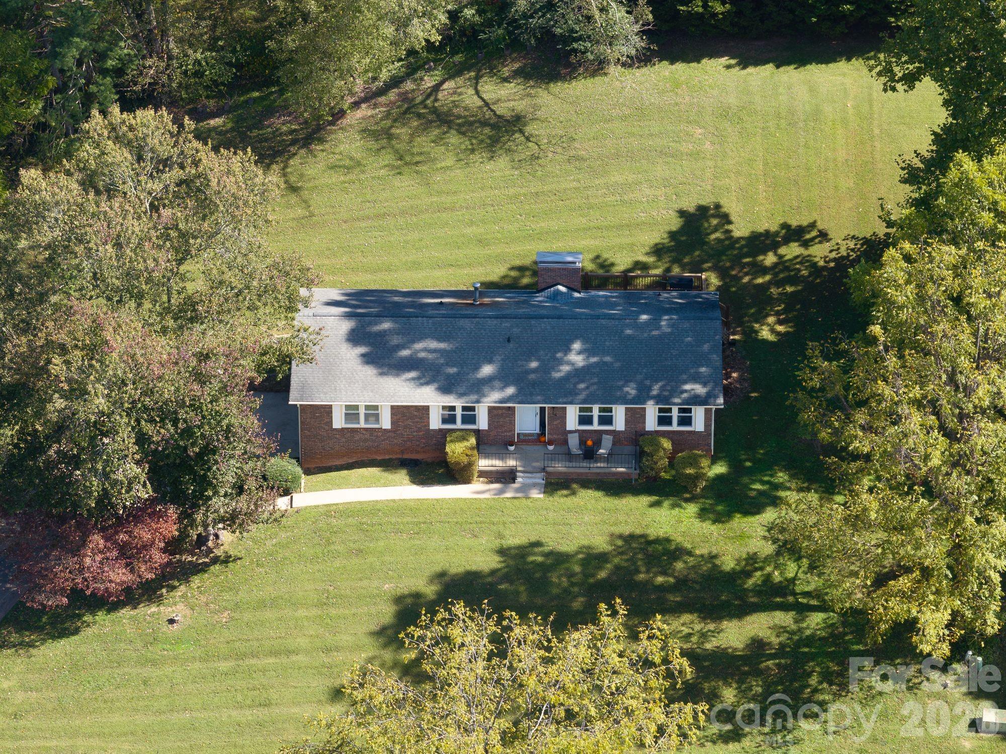 16 Sun Valley Court Alexander, NC 28701 - Photo 27 of 47 a view of a lake with a house in the background