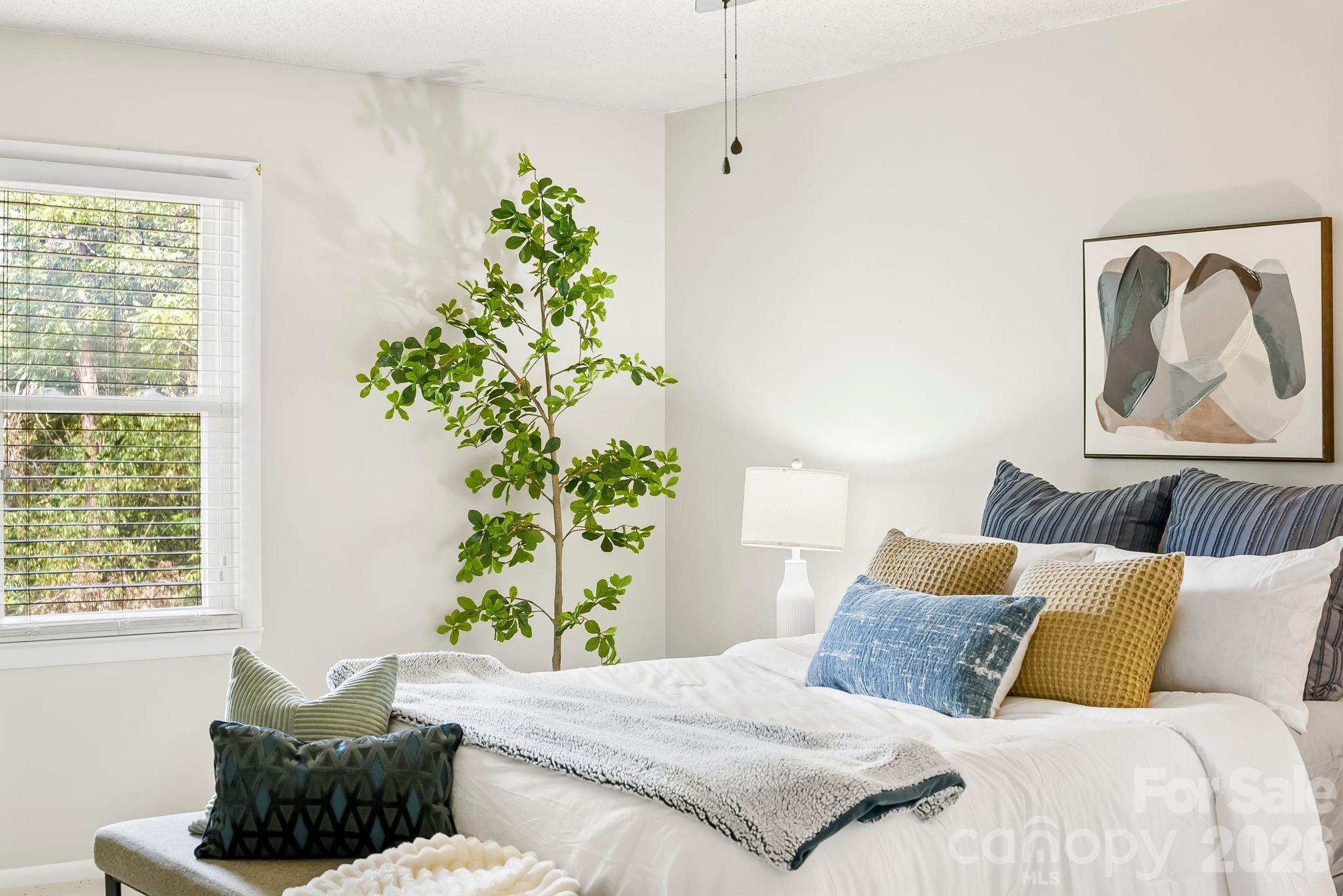 16 Sun Valley Court Alexander, NC 28701 - Photo 4 of 47 a bedroom with a bed and a window