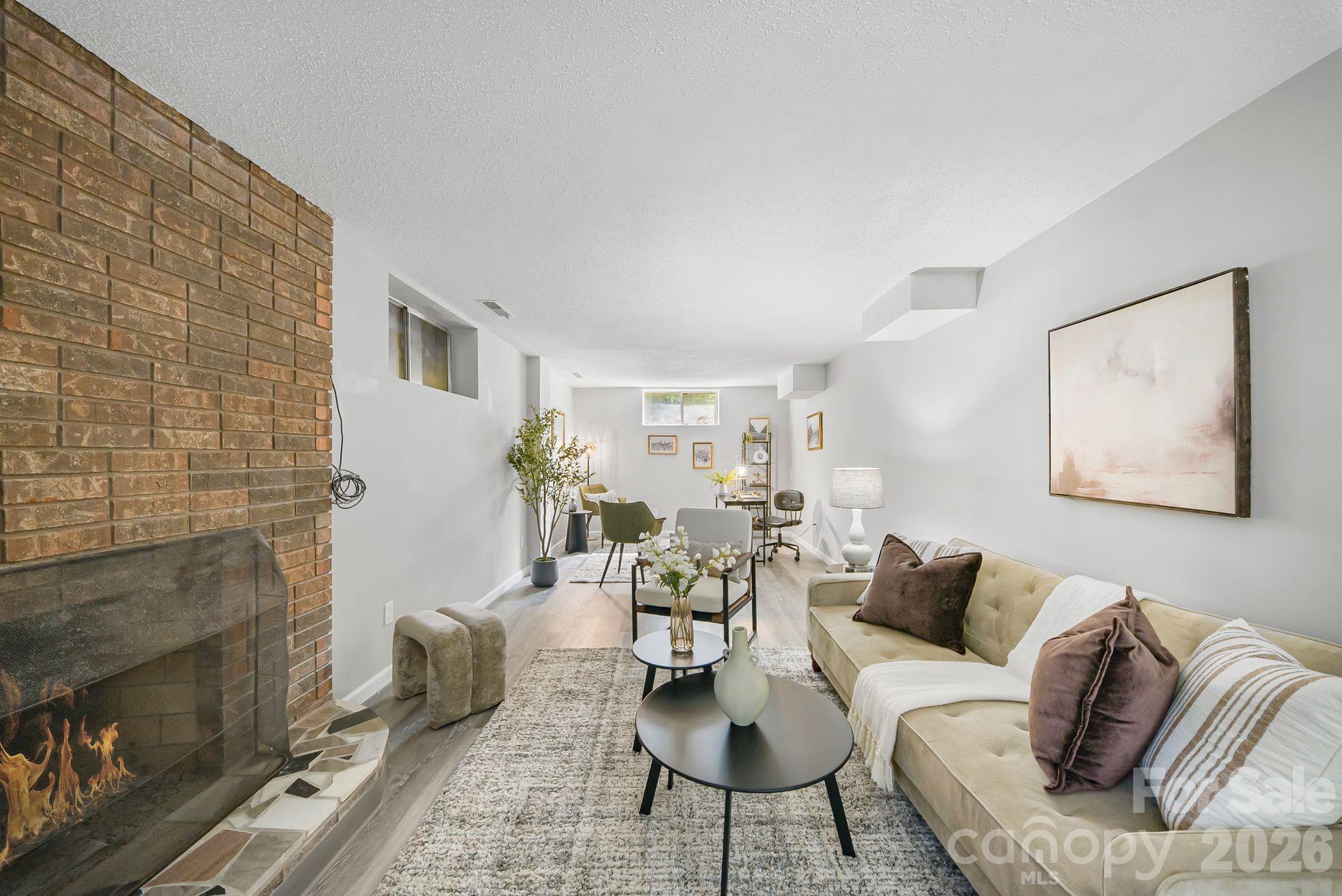 16 Sun Valley Court Alexander, NC 28701 - Photo 5 of 47 a living room with furniture and a fireplace