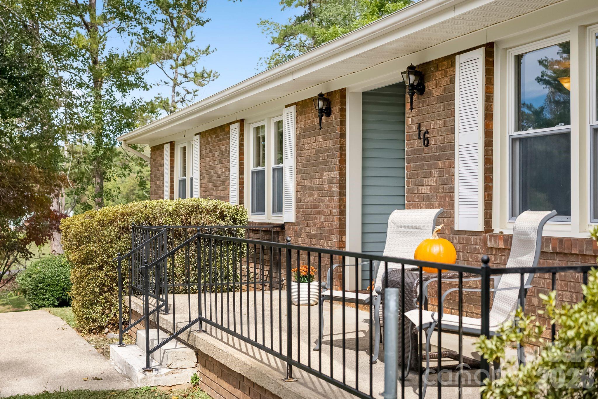 16 Sun Valley Court Alexander, NC 28701 - Photo 6 of 47 a view of a house with backyard and sitting area