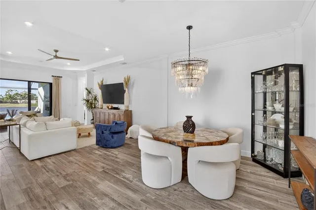 a kitchen with kitchen island granite countertop a table and chairs in it