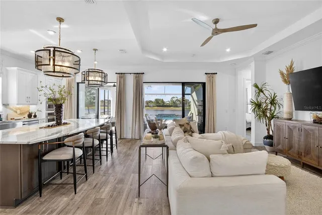 a bathroom with a granite countertop shower a sink and a mirror