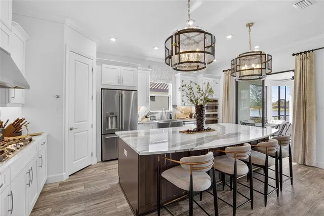 a bathroom with a granite countertop sink a large mirror and a shower