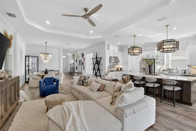 a view of a patio with a table and chairs under an umbrella