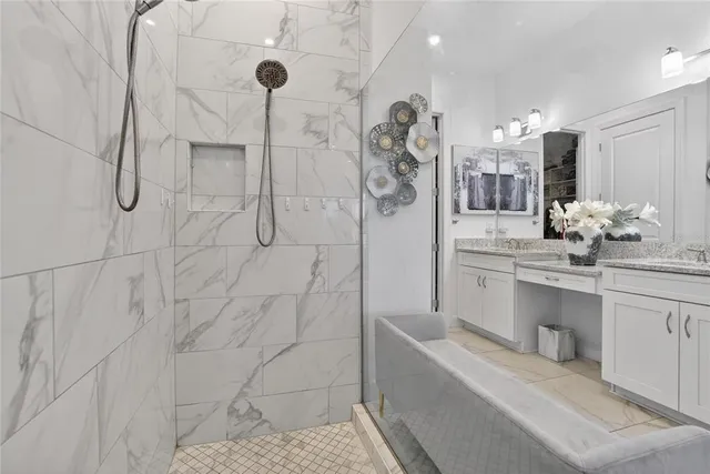 a front view of a house with garden and trees