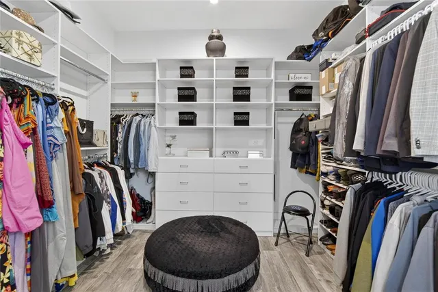 a view of a swimming pool with a patio and a garden