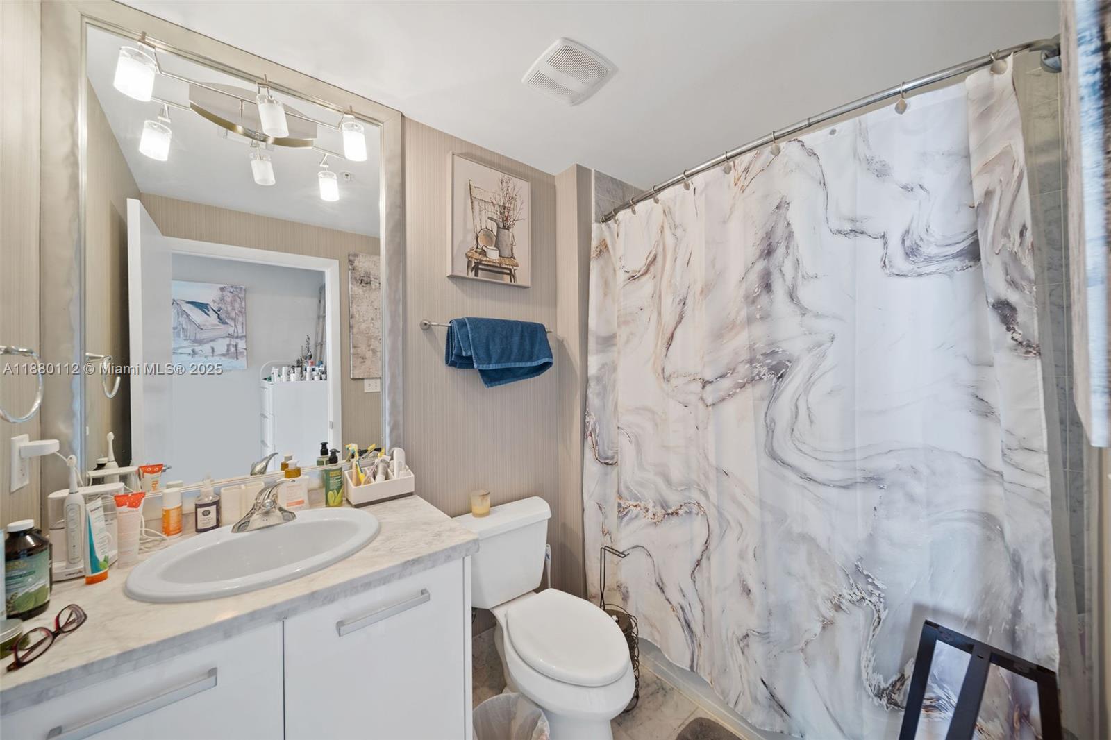 244 Biscayne Boulevard, Unit 4608 Miami, FL 33132 - Photo 16 of 45 a bathroom with a sink toilet and shower