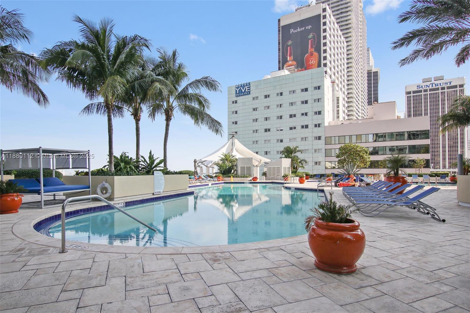 244 Biscayne Boulevard, Unit 4608 Miami, FL 33132 - Photo 27 of 45 a view of a swimming pool with outdoor seating
