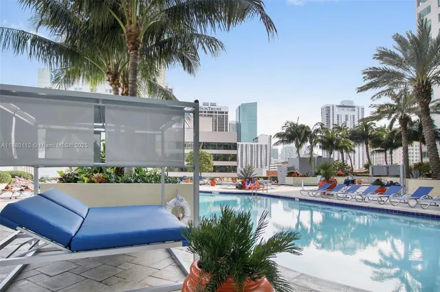 a view of a swimming pool with a patio