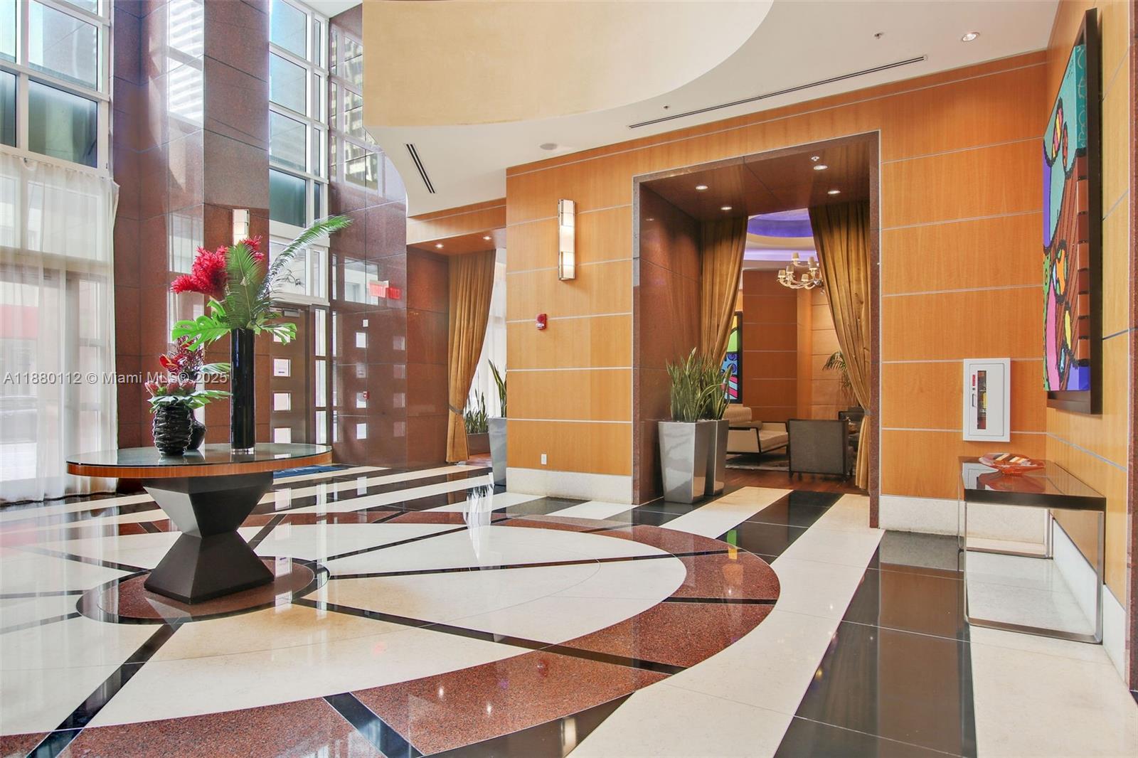 244 Biscayne Boulevard, Unit 4608 Miami, FL 33132 - Photo 29 of 45 a lobby with furniture and chandelier