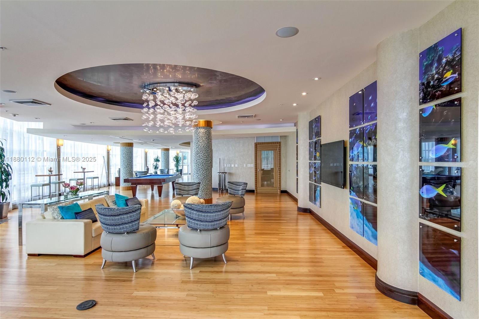 244 Biscayne Boulevard, Unit 4608 Miami, FL 33132 - Photo 33 of 45 a living room with furniture and a chandelier