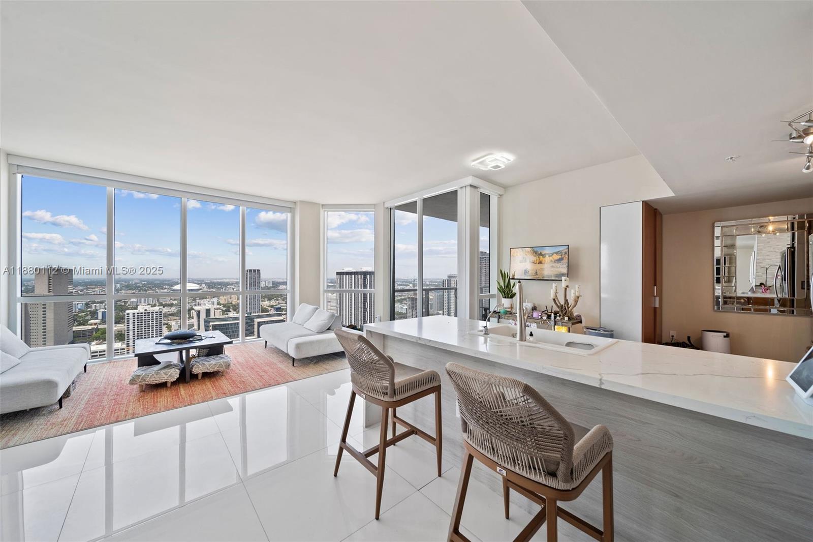 244 Biscayne Boulevard, Unit 4608 Miami, FL 33132 - Photo 7 of 45 a living room with furniture and a large window