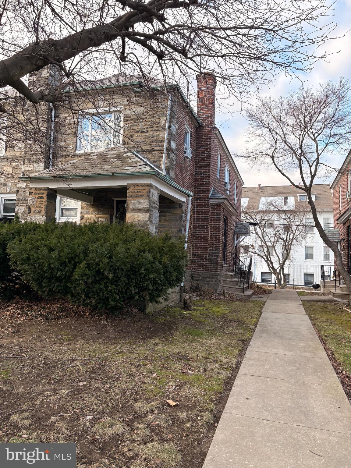 5757 Drexel Road Philadelphia, PA 19131 - Photo 2 of 31 Charming stone-front home with lush greenery.