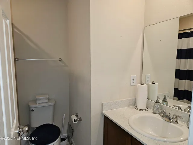 a bedroom with a workspace