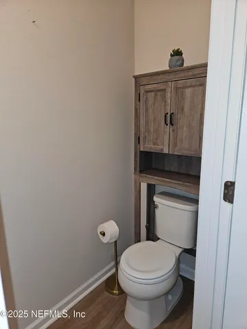 a bathroom with a toilet and a sink