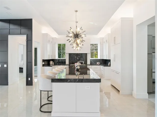 a kitchen with a sink and cabinets