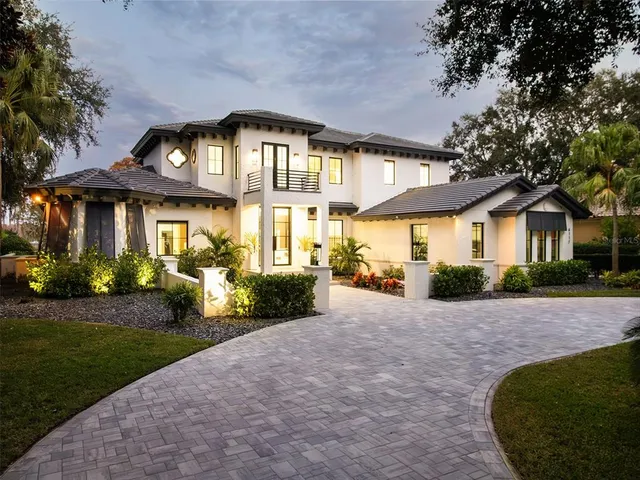 a front view of a house with a garden and porch