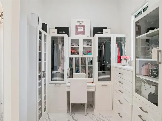 a bathroom with a sink toilet vanity and shower