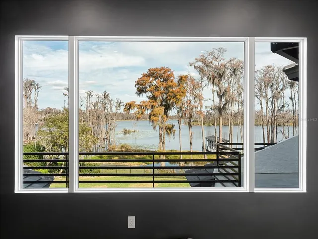 a kitchen with granite countertop a sink and a microwave