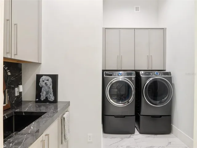 a view of a house with swimming pool and a yard