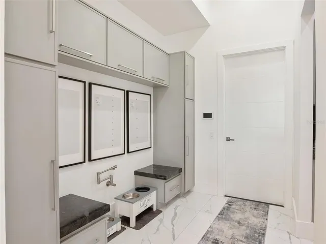 a view of a swimming pool with a lawn chairs