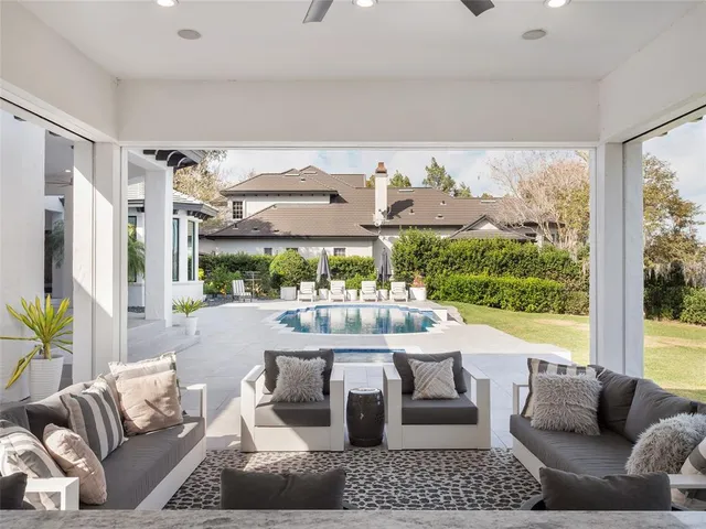a view of pool with outdoor seating