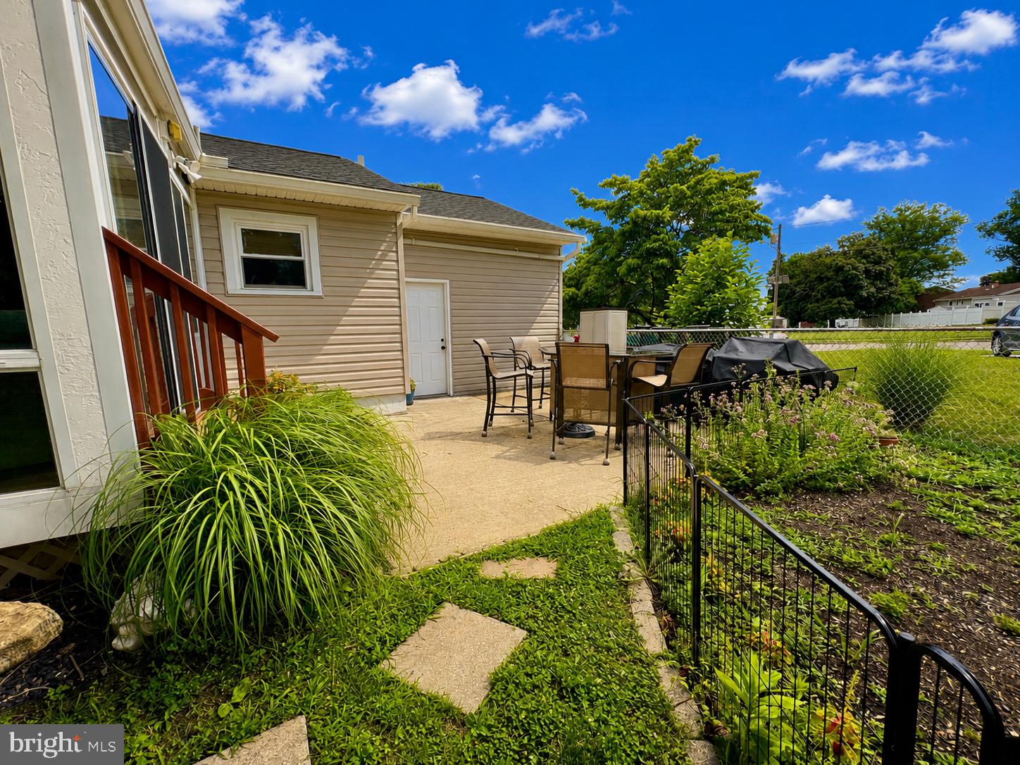 4 Running Brook Road Ewing, NJ 08638 - Photo 40 of 46 Sunny patio oasis with lush greenery.