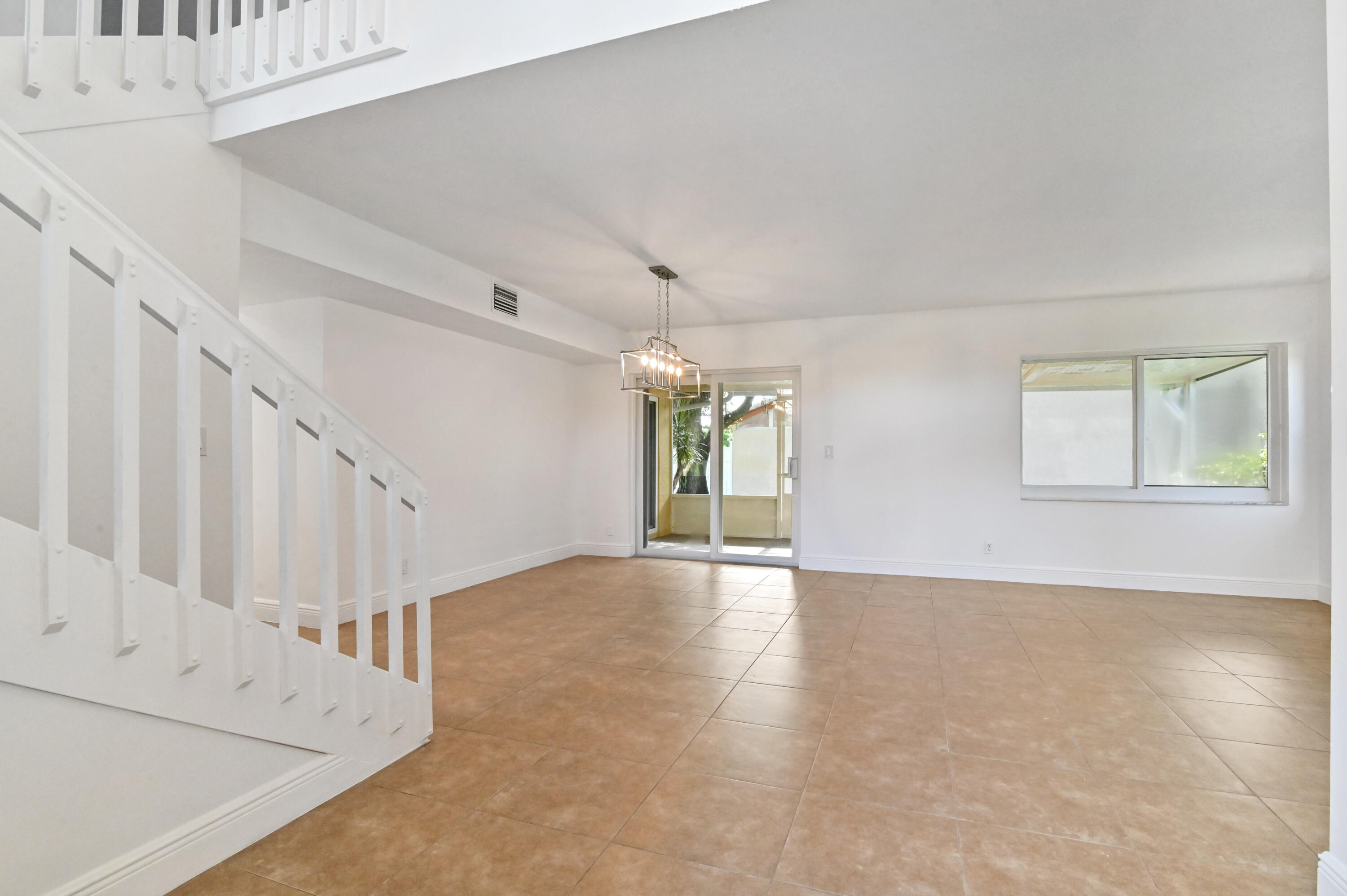 10286 Boca Springs Drive Boca Raton, FL 33428 - Photo 4 of 44 Foyer view into Living/Dining Area