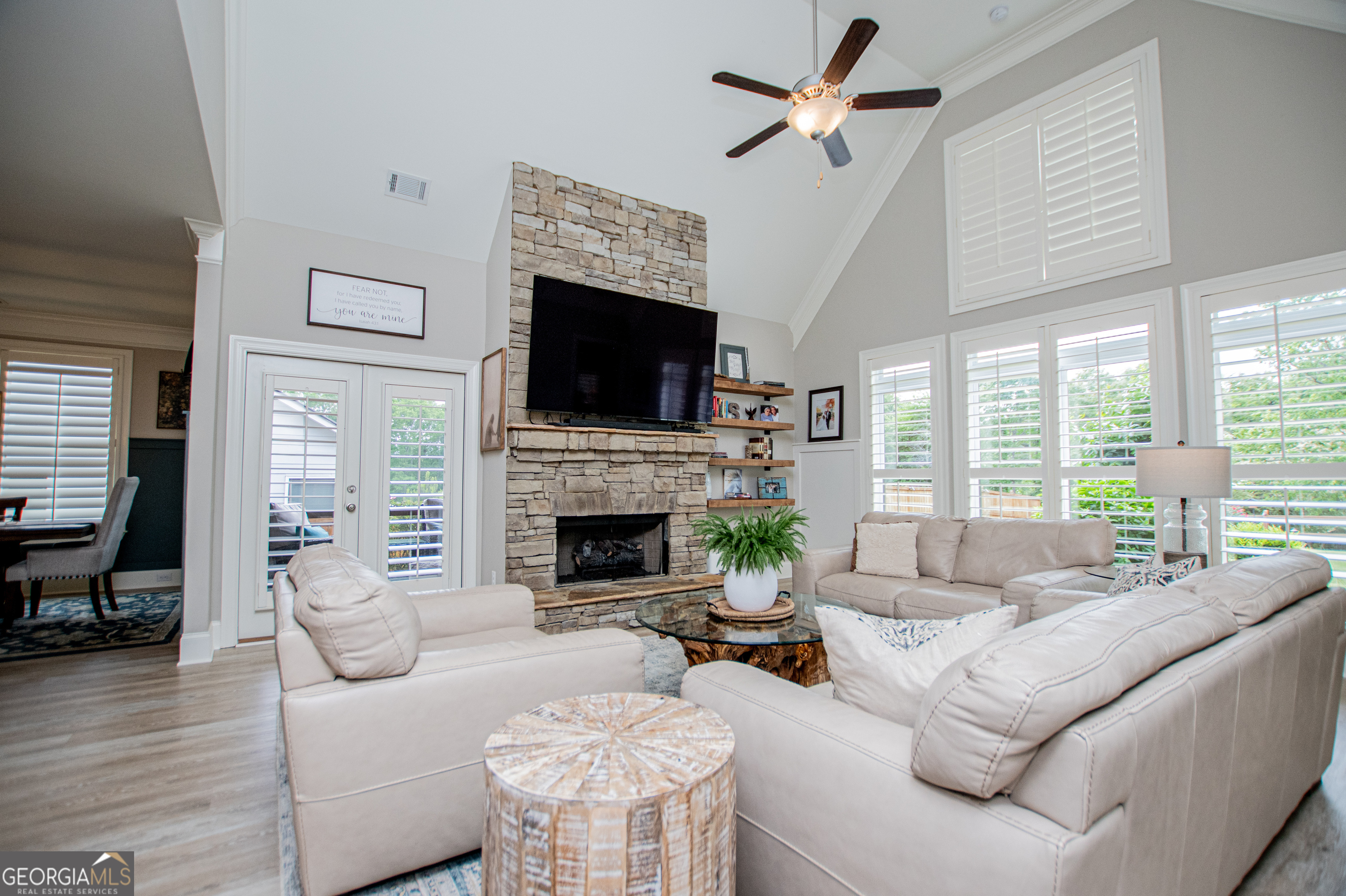 216 Yorkshire Lane Villa Rica, GA 30180 - Photo 25 of 94 a living room with furniture a fireplace and a flat screen tv