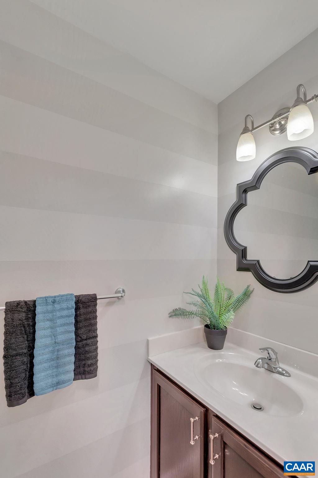 421 Rudolph Street Ruckersville, VA 22968 - Photo 23 of 42 a bathroom with a sink and a mirror